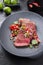 Traditional South American barbecue wagyu roast beef sliced with pico de gallo and salsa verde garnished in a modern design plate