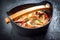 Traditional South American moqueca de peixe with prawns, mussels and fish in a modern design Japanese cast-iron roasti