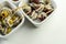 The traditional Spanish appetizers of olives, tomatoes and anchovies in a white ceramic bowls