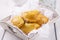 Traditional Spanish baked empanada de carne with chicken and vegetable in a wooden tray