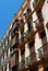Traditional Spanish balconies on inner city apartments, Malaga, Spain.