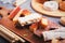 Traditional Spanish Christmas sweets turron, polvorones, mantecados with Christmas decor on grey table top