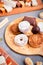 Traditional Spanish Christmas sweets turron, polvorones, mantecados with Christmas decor on grey table top