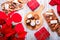 Traditional Spanish Christmas sweets turron, polvorones, mantecados with Christmas decor and red gift boxes on light