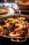 A traditional Spanish dish. Seafood paella with rice, mussels, shrimp. Menu, the recipe.