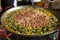 Traditional spanish paella with seafood and pork. Prepared.