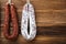 Traditional spanish smoked sausages meat hanging on light wooden background with copy space