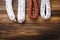 Traditional spanish smoked sausages meat hanging on light wooden background, flat lay with copy space
