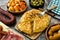Traditional spanish tapas. Croquettes, olives, omelette, ham and patatas bravas on wood