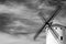 Traditional Spanish windmill in Campo de Criptana, Spain, on the famous Don Quixote Route; black and white image
