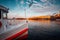 Traditional steamer boat on Alster Lake in foreground. Golden autumn light at sunset. Seagulls circling over water