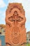 Traditional stone khachkar Armenian with lace tufa