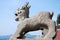 Traditional stone sculpture in front of temple in Sandouping