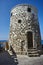 Traditional stone, windmill on the sea shore