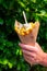 Traditional street food in Belgium and Netherlands, French fried potatoes chips with mayonnaise sauce in paper cone