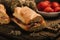 Traditional street food of Sicily, Italy. Pane cunzato on wooden table