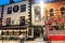 Traditional street scene in quaint architecture of shop and pub frontages under night light, Wexford