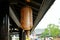 A traditional style lantern hanging under the eaves