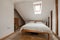 Traditional styled attic type furnished bedroom