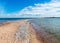 Traditional summer landscape with sandy and pebbly promontory, blue sea and sky, Harilaid Nature Reserve, Estonia, Baltic Sea