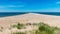 Traditional summer landscape with sandy and pebbly promontory, blue sea and sky, Harilaid Nature Reserve, Estonia, Baltic Sea