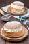 Traditional swedish dessert Semla or Shrove bun, with almond paste and whipped cream filling, vertical