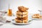 Traditional sweet and savory American dish of crunchy fried chicken and waffles drizzled with maple syrup. Hearty comfort food