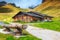 Traditional Swiss alpine farmhouse and misty mountains, Bernese Oberland, Switzerland