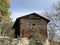 Traditional Swiss architecture and wooden alpine houses in the autumn environment of mountain pastures and mixed forests