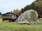 Traditional Swiss architecture and wooden alpine houses in the autumn environment of mountain pastures and mixed forests