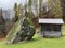 Traditional Swiss architecture and wooden alpine houses in the autumn environment of mountain pastures and mixed forests