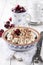 Traditional Swiss cherry pie with meringue topping in a baking form