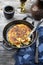 Traditional Swiss hash browns as side dish in a frying pan on a wodden rustic table