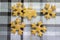 Traditional tasty Czech gingerbreads, Christmas background with snowflakes and reindeer on white and grey chequered tablecloth