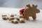 Traditional tasty Czech gingerbreads, Christmas snowflake and reindeer on wooden table, red jingle bell