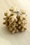 Traditional tasty Czech gingerbreads tied with jute rope, Christmas snowflakes on wooden table