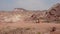 A traditional tent of arabian desert people with desert mountains in background