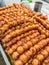 Traditional Thai charcoal roasted Isaan Sausage, on banana leaf background. Asian, Thai styled street food appetizer