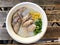 Traditional thai porridge rice gruel in white bowl congee