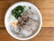 Traditional thai porridge rice gruel in white bowl congee