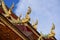 Traditional thai style art in the roof temple of buddhism