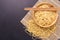 Traditional Thai yellow noodle on black stone table background