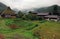 Traditional thatched farmhouses kayabuki on a very rainy and cloudy day in the historic village of Miyama