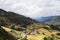 Traditional Tibetan countryside with fields and mountains around Daocheng