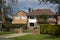 Traditional, tipycal english house. Brick stone house. street view. Spring time