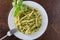 Traditional trofie pasta with pesto sauce on white plate