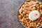 Traditional Tunisian chickpea soup served for breakfast Lablabi with a poached egg and tuna closeup in the bowl. Horizontal top