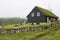 Traditional turf church in Faroe islands foggy day. Kaldbak village