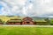 Traditional turf roof house with green hills in the foreground, Valle, Aust-Agder county, Norway