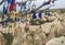 Traditional Turkish amulets and decorations hang on the branches of a wishes tree against the backdrop of the volcanic landscape